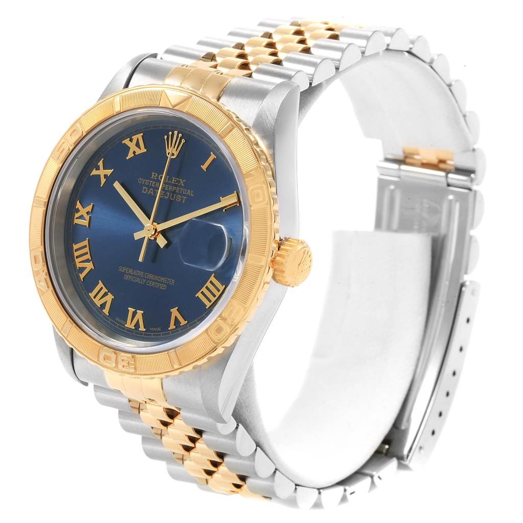 This image shows a Rolex Turn-o-Graph 16263 Men's Steel and Gold (two tone) Blue Dial 16263 Men's Steel and Gold (two tone) Blue Dial watch at a three-quarter view, highlighting its blue dial, gold bezel, and two-tone bracelet.