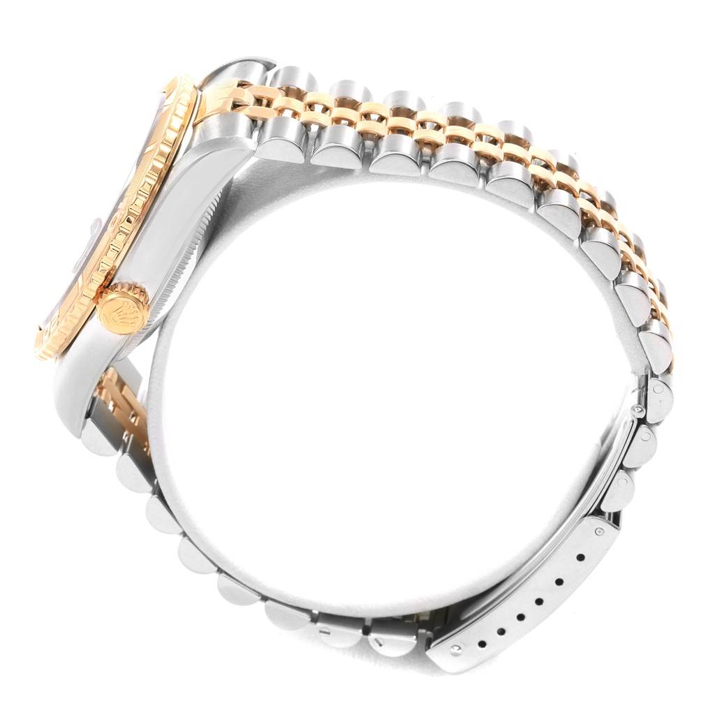 This Rolex Turn-o-Graph 16263 Men's Steel and Gold (two tone) Blue Dial 16263 Men's Steel and Gold (two tone) Blue Dial watch is shown from a side angle, highlighting its crown, bezel, and bracelet.