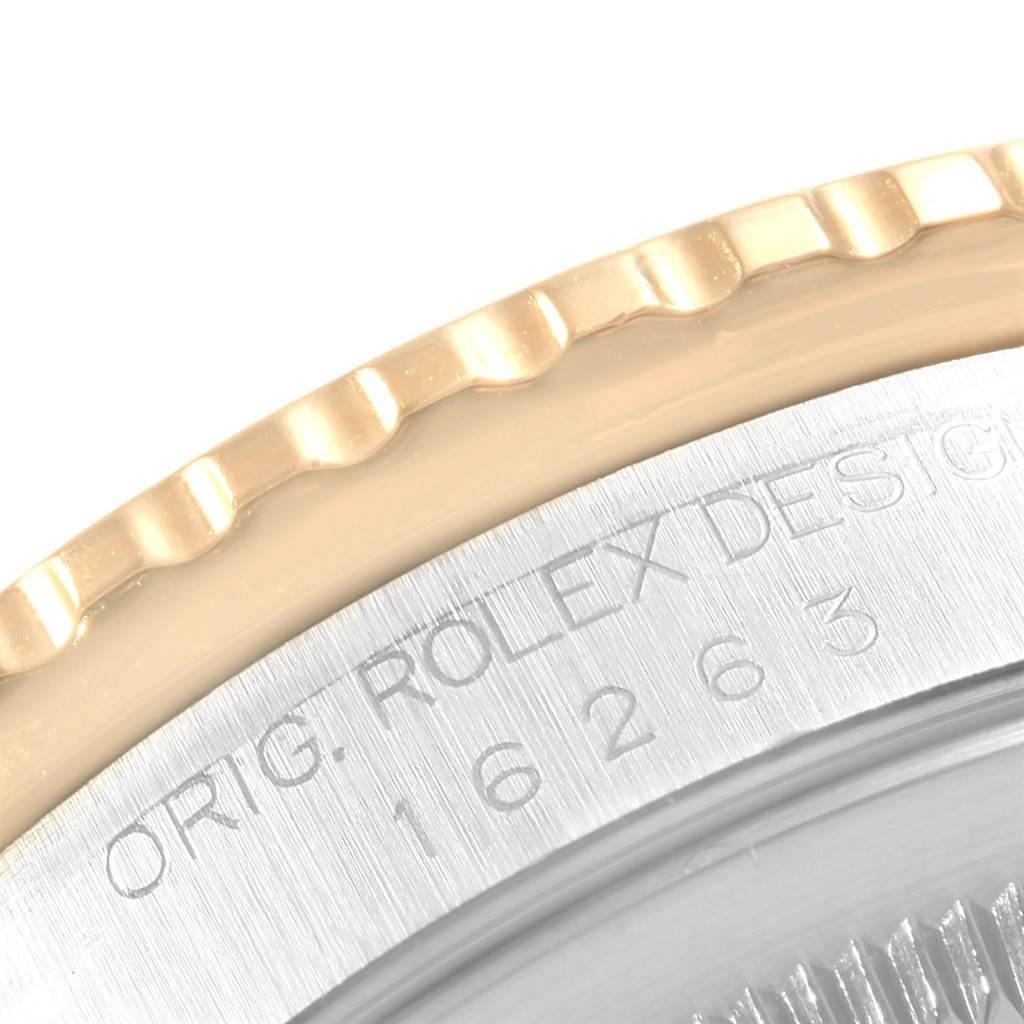 This image shows a close-up of the bezel and engraved case back of a Rolex Turn-o-Graph 16263 Men's Steel and Gold (two tone) Blue Dial 16263 Men's Steel and Gold (two tone) Blue Dial.