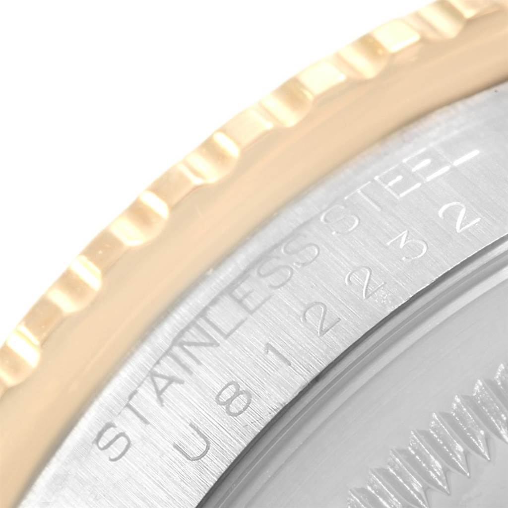 This close-up image shows the bezel and part of the case back with engravings on the Rolex Turn-o-Graph 16263 Men's Steel and Gold (two tone) Blue Dial 16263 Men's Steel and Gold (two tone) Blue Dial watch.