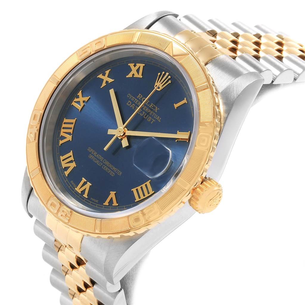 This image shows a Rolex Turn-o-Graph 16263 Men's Steel and Gold (two tone) Blue Dial 16263 Men's Steel and Gold (two tone) Blue Dial watch at a slight side angle, highlighting its blue dial, gold bezel, and two-tone bracelet.
