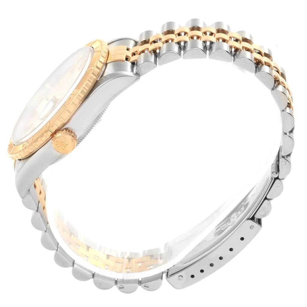 This image shows a side view of a Rolex Turn-o-Graph 16263 Men's Steel and Gold (two tone) Silver Dial 16263 Men's Steel and Gold (two tone) Silver Dial, highlighting its crown, bezel, and bracelet.