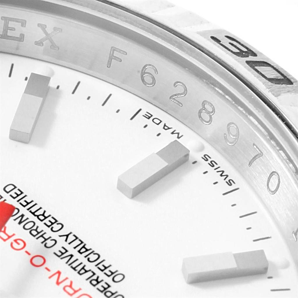 This close-up image of the Rolex Turn-o-Graph 116264 Men's Stainless Steel White Dial 116264 Men's Stainless Steel White Dial watch shows the serial number, part of the bezel, and the watch face with hour markers.