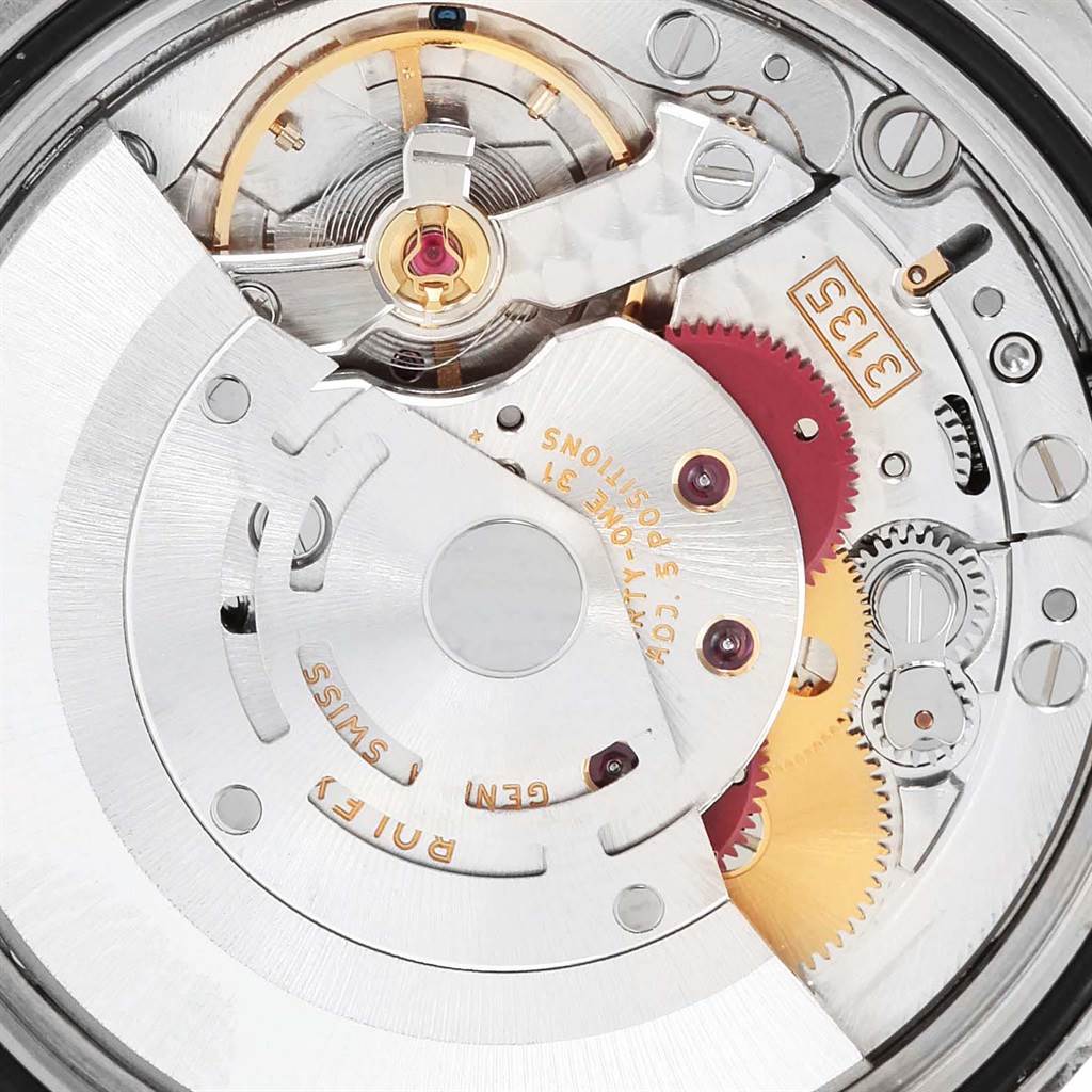The image shows a close-up of the movement of a Rolex Turn-o-Graph 116264 Men's Stainless Steel White Dial 116264 Men's Stainless Steel White Dial watch, highlighting gears and intricate internal mechanisms.