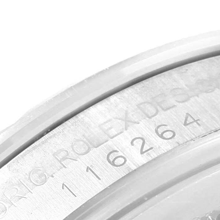 The image shows a close-up view of the engraved inner bezel of a Rolex Turn-o-Graph 116264 Men's Stainless Steel White Dial 116264 Men's Stainless Steel White Dial watch.