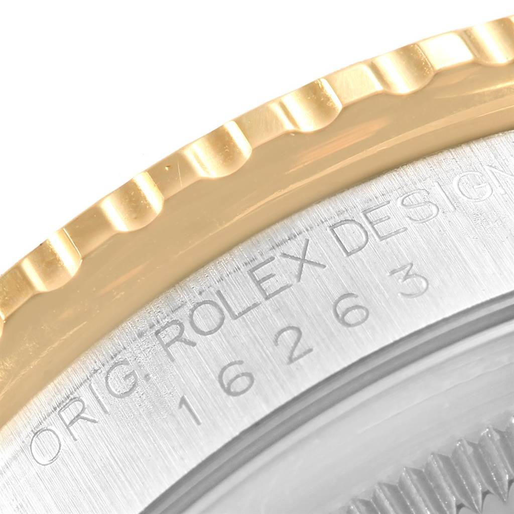 This image shows a close-up of the bezel and part of the casing with engraved text for the Rolex Turn-o-Graph 16263 Men's Steel and Gold (two tone) White Dial 16263 Men's Steel and Gold (two tone) White Dial watch.