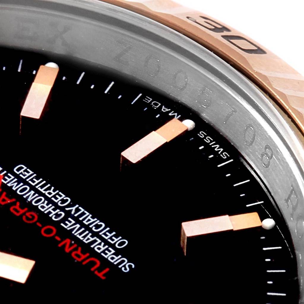 The image shows a close-up of the dial and the bezel of a Rolex Turn-o-Graph 116261 Men's Stainless Steel Black Dial 116261 Men's Stainless Steel Black Dial watch, highlighting the markers and part of the text on the dial.