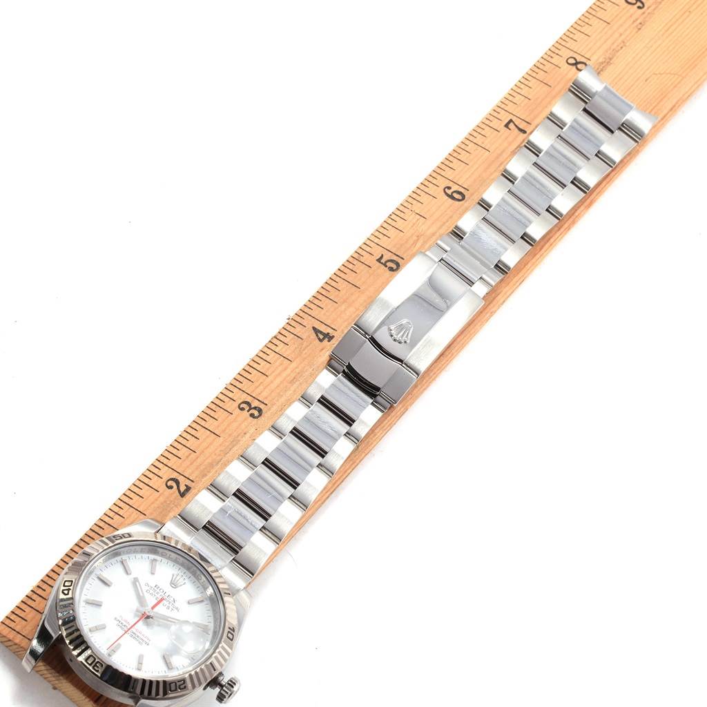 The image shows a Rolex Turn-o-Graph 116264 Men's Stainless Steel White Dial 116264 Men's Stainless Steel White Dial watch laid flat next to a ruler, displaying the face, bracelet, and clasp.