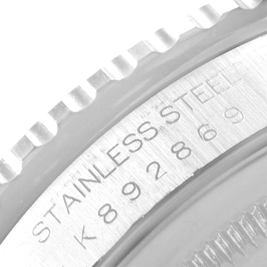 This image shows a close-up of the bezel and part of the casing with the serial engraving of a Rolex Turn-o-Graph 16264 Men
s Stainless Steel Blue Dial 16264 Men
s Stainless Steel Blue Dial watch in stainless steel.