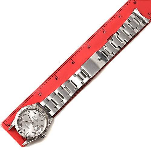 The image shows a top-down view of a Rolex Turn-o-Graph 16264 Men's Stainless Steel Grey Dial 16264 Men's Stainless Steel Grey Dial watch fully extended next to a red ruler for size reference.