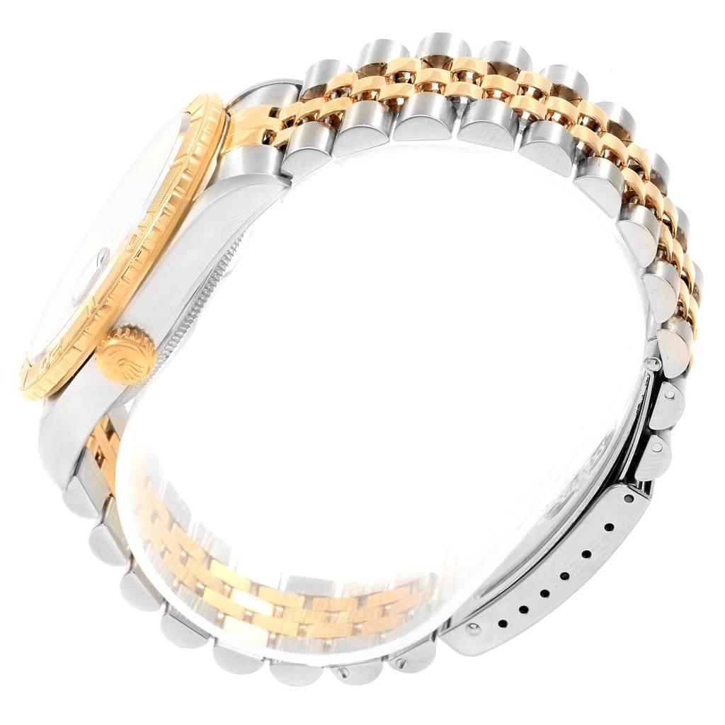 The image shows the side view of a Rolex Turn-o-Graph 16263 Men
s Steel and Gold (two tone) Blue Dial 16263 Men
s Steel and Gold (two tone) Blue Dial watch, highlighting its two-tone bracelet and golden bezel.