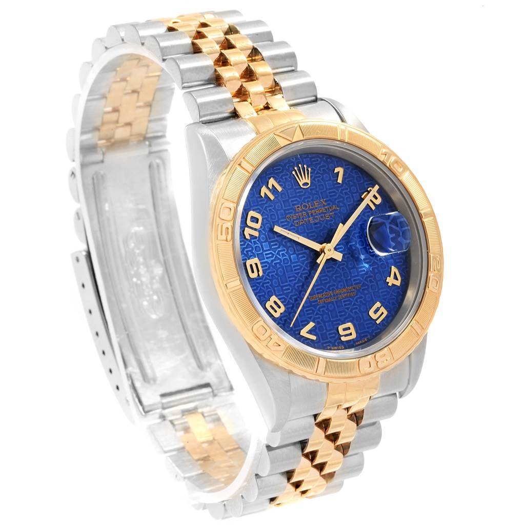 The image shows a Rolex Turn-o-Graph 16263 Men
s Steel and Gold (two tone) Blue Dial 16263 Men
s Steel and Gold (two tone) Blue Dial watch at a semi-side angle, highlighting its blue dial, two-tone bracelet, and gold bezel.