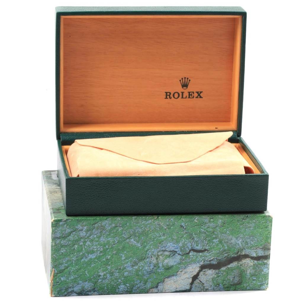 The image shows a green and wood Rolex Turn-o-Graph 16263 Men's Steel and Gold (two tone) Champagne Dial 16263 Men's Steel and Gold (two tone) Champagne Dial watch box, with the box partially open, revealing a beige cloth inside.