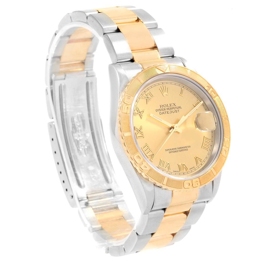 The image shows a Rolex Turn-o-Graph 16263 Men's Steel and Gold (two tone) Champagne Dial 16263 Men's Steel and Gold (two tone) Champagne Dial watch from an angle highlighting its gold bezel, gold dial, and two-tone metal bracelet.