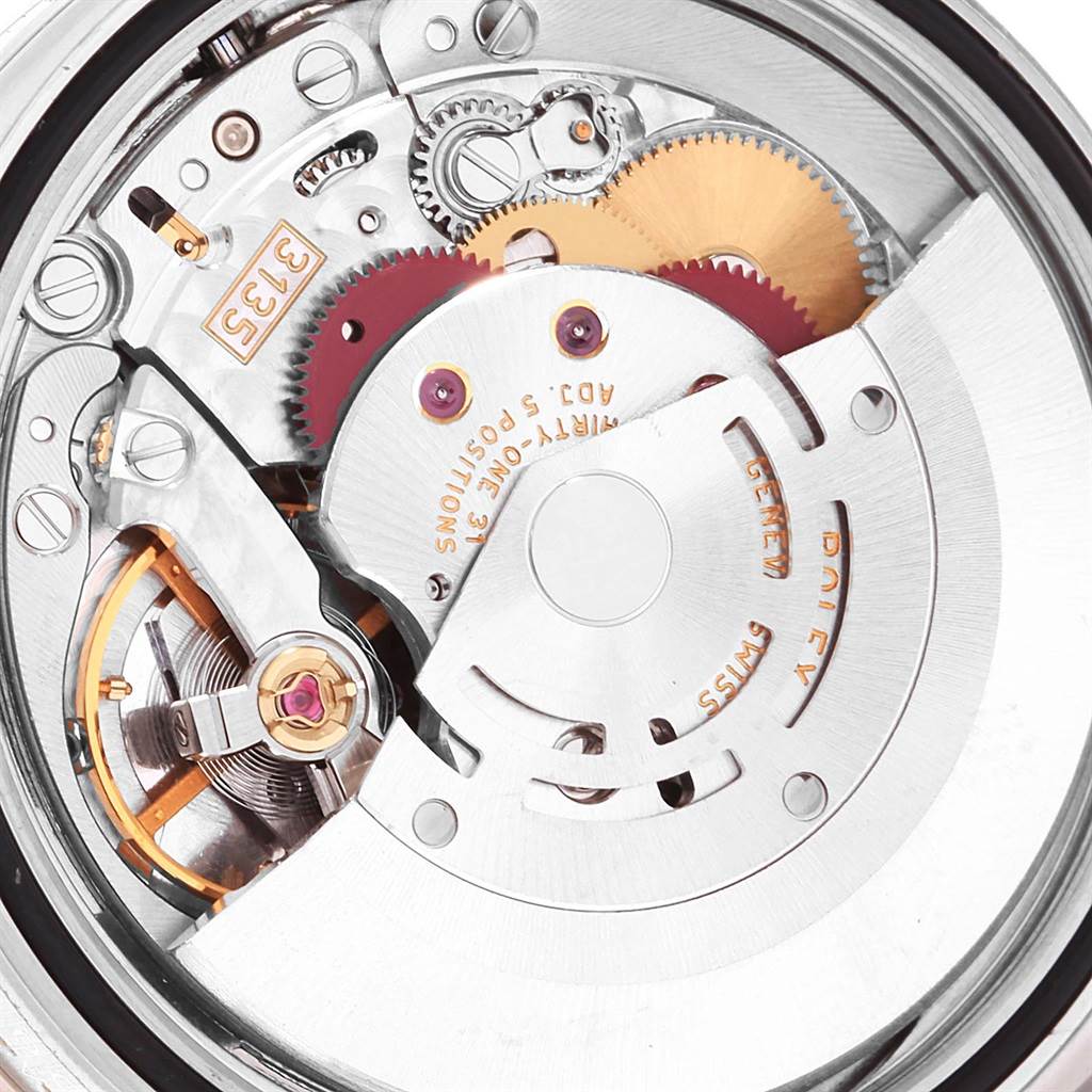 This image shows a close-up view of the movement and internal gears of a Rolex Turn-o-Graph 116264 Men's Stainless Steel White Dial 116264 Men's Stainless Steel White Dial watch model.