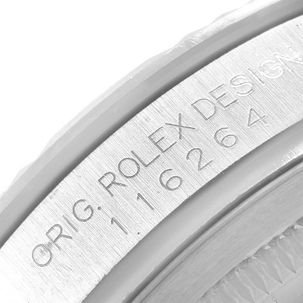 The image shows a close-up angle of the engraved edge of the Rolex Turn-o-Graph 116264 Men's Stainless Steel White Dial 116264 Men's Stainless Steel White Dial watch case, displaying the model number.