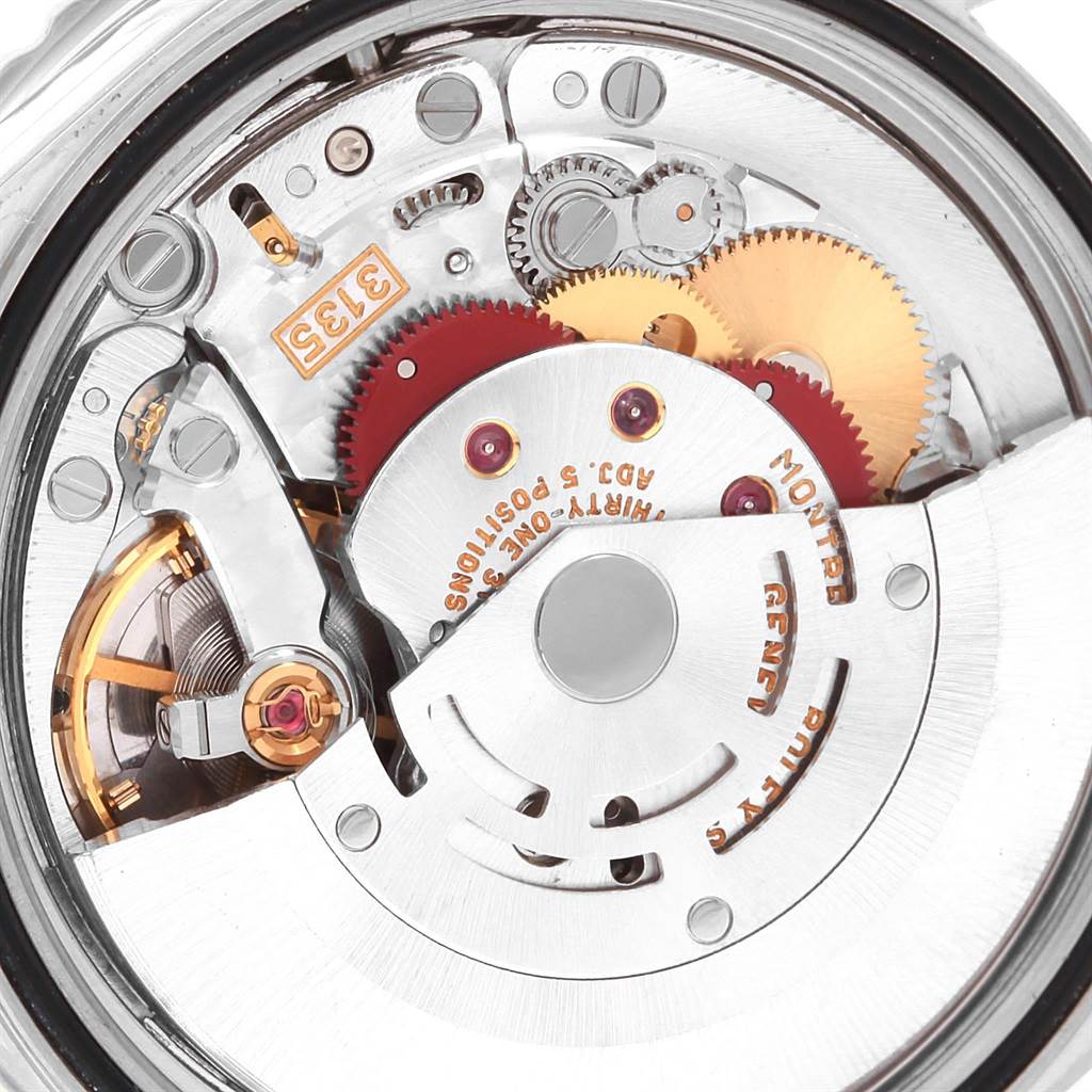 This image shows a close-up of the Turn-o-Graph model by Rolex, focusing on its intricate internal mechanisms and gears.