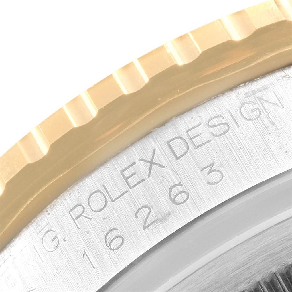 The image shows a close-up of the bezel and engraved side of a Rolex Turn-o-Graph 16263 Men's Steel and Gold (two tone) Black Dial 16263 Men's Steel and Gold (two tone) Black Dial watch.