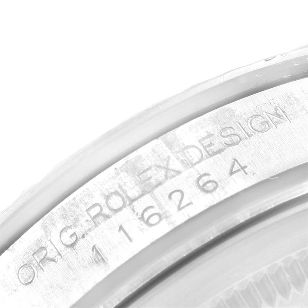 The image shows a close-up of the case side engraving of a Rolex Turn-o-Graph 116264 Men
s Stainless Steel Black Dial 116264 Men
s Stainless Steel Black Dial model.