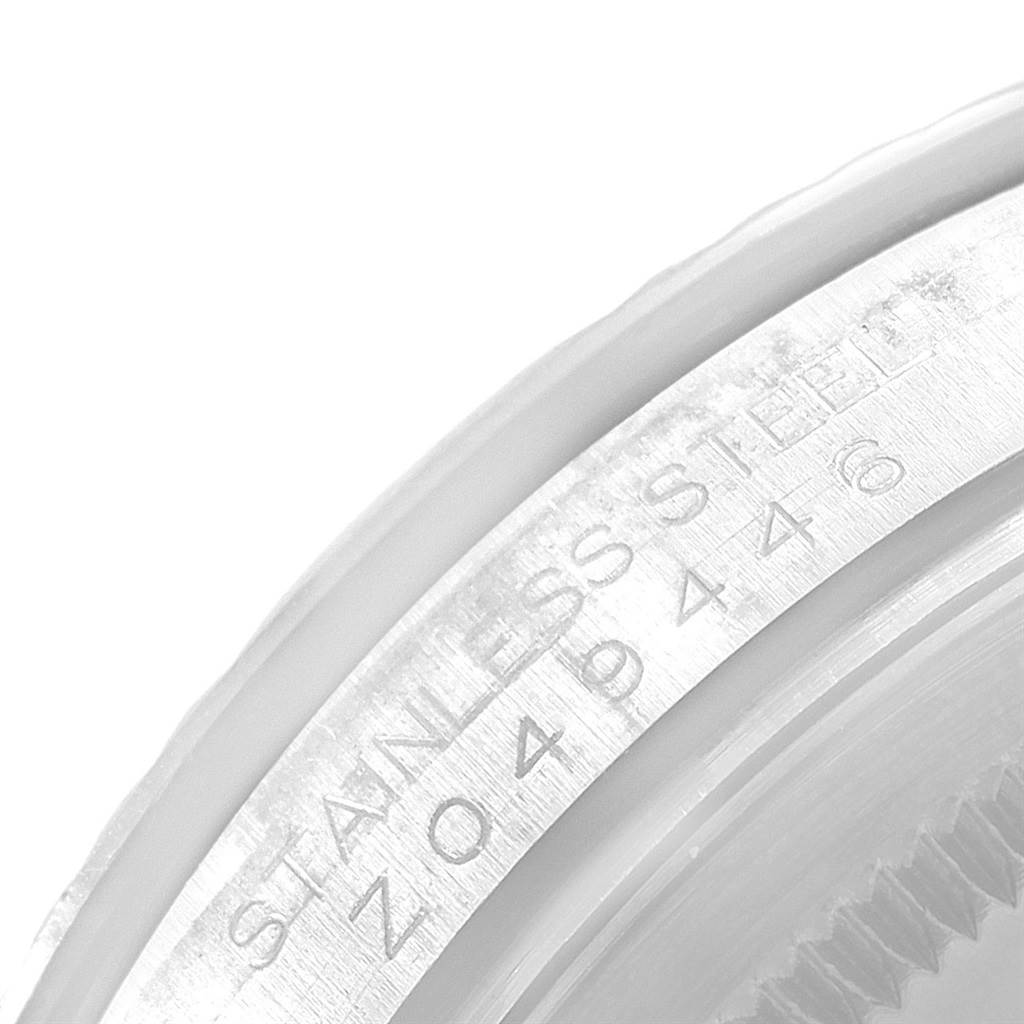 This close-up image shows the serial number engraving on the stainless steel case of a Rolex Turn-o-Graph 116264 Men
s Stainless Steel Black Dial 116264 Men
s Stainless Steel Black Dial watch.