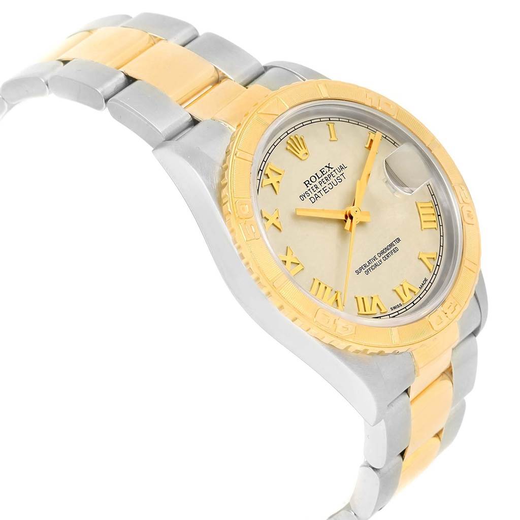 The Rolex Turn-o-Graph 16263 Men
s Steel and Gold (two tone) Beige Dial 16263 Men
s Steel and Gold (two tone) Beige Dial watch is shown at a slight angle, highlighting its gold bezel, dial, and two-tone bracelet.