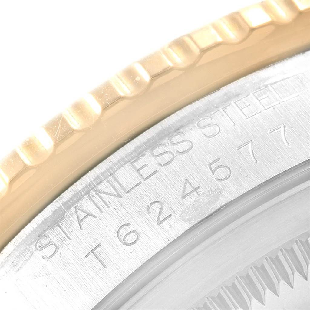 This image shows a close-up of the bezel and case side of a Rolex Turn-o-Graph 16263 Men
s Steel and Gold (two tone) Beige Dial 16263 Men
s Steel and Gold (two tone) Beige Dial watch, highlighting the "STAINLESS STEEL" engraving and serial number.