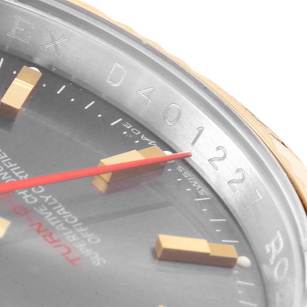 This close-up image shows the partially visible dial, markers, and engraved bezel of the Rolex Turn-o-Graph 116263 Men
s Steel and Gold (two tone) Grey Dial 116263 Men
s Steel and Gold (two tone) Grey Dial watch.