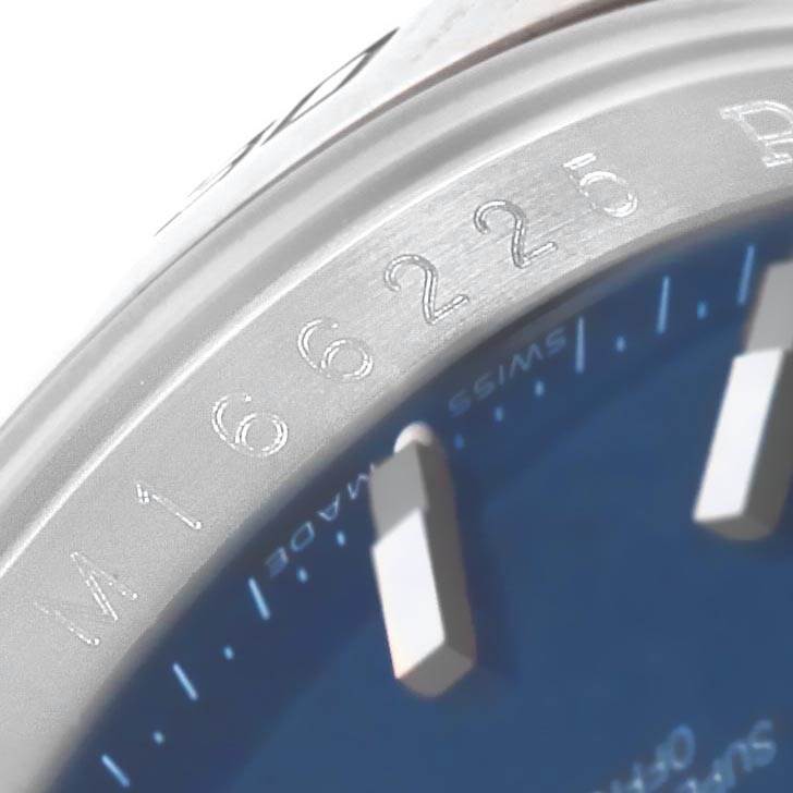 The image shows a close-up angle of the bezel and part of the dial of a Rolex Turn-o-Graph 116264 Men's Stainless Steel Blue Dial 116264 Men's Stainless Steel Blue Dial model watch.