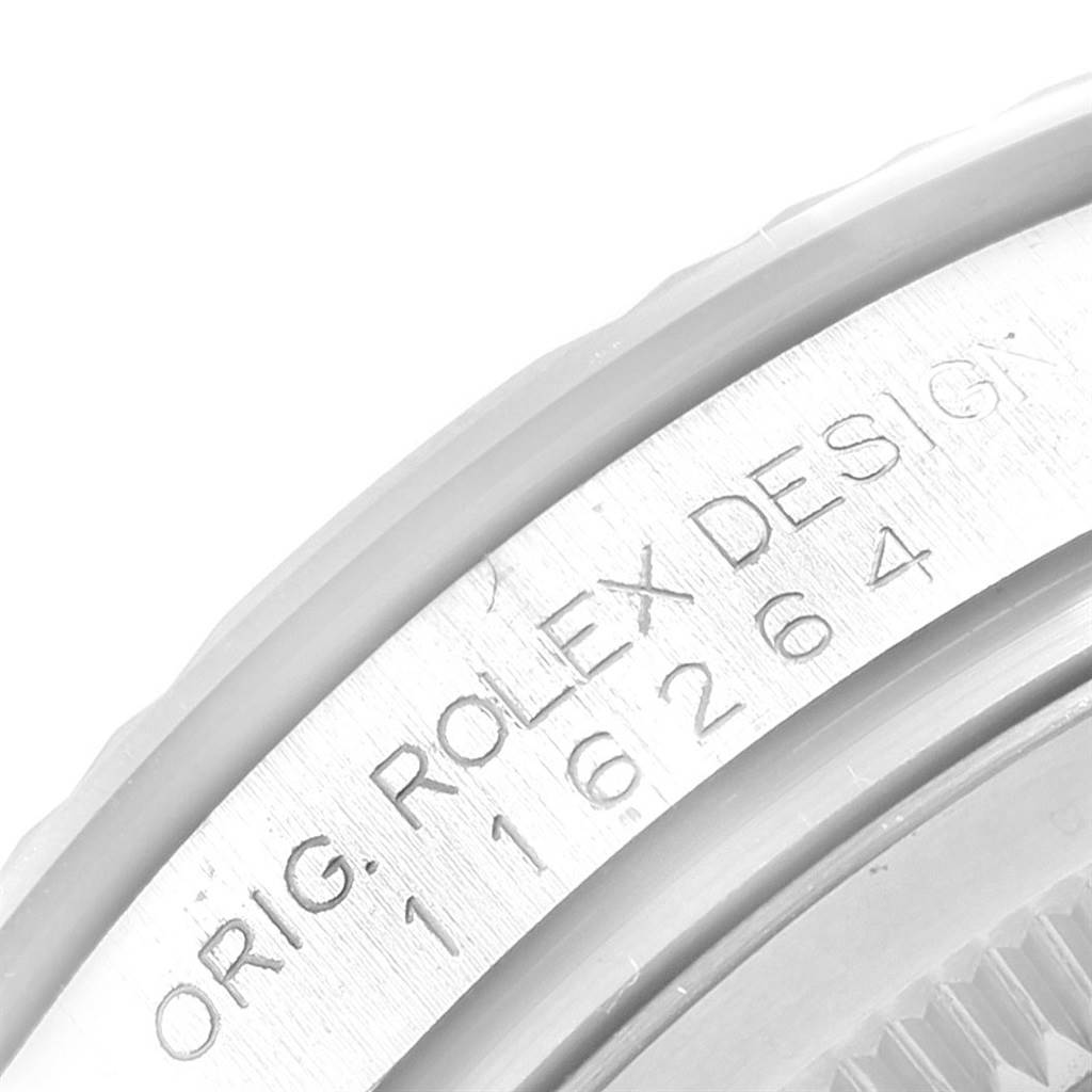 Close-up of the side of a Rolex Turn-o-Graph 116264 Men's Stainless Steel Blue Dial 116264 Men's Stainless Steel Blue Dial watch showing the model number and "ORIG. ROLEX DESIGN" engraving.