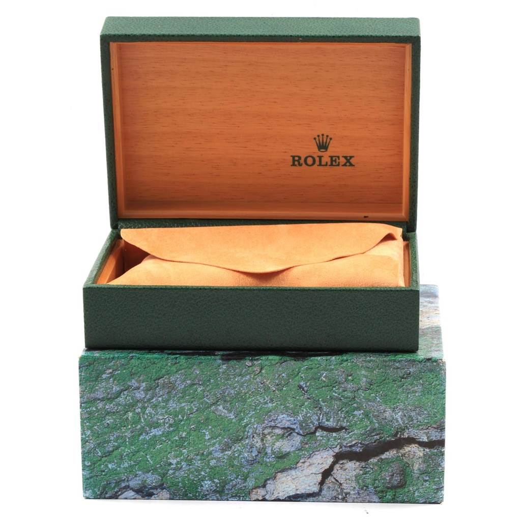 The image shows an open Rolex Turn-o-Graph 16264 Men
s Stainless Steel White Dial 16264 Men
s Stainless Steel White Dial watch box with a green exterior, wooden interior, and an orange cushion inside.