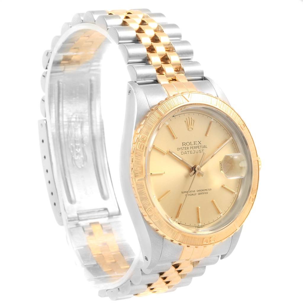 This image shows a side angle of the Rolex Turn-o-Graph 16253 Men
s Steel and Gold (two tone) Champagne Dial 16253 Men
s Steel and Gold (two tone) Champagne Dial watch, highlighting its gold bezel, dial, and two-tone Jubilee bracelet.