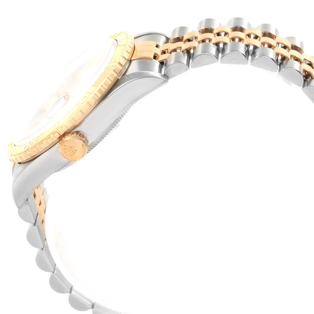 The image shows a side view of the Rolex Turn-o-Graph 16253 Men
s Steel and Gold (two tone) Champagne Dial 16253 Men
s Steel and Gold (two tone) Champagne Dial watch, focusing on the bezel, crown, and part of the bracelet.