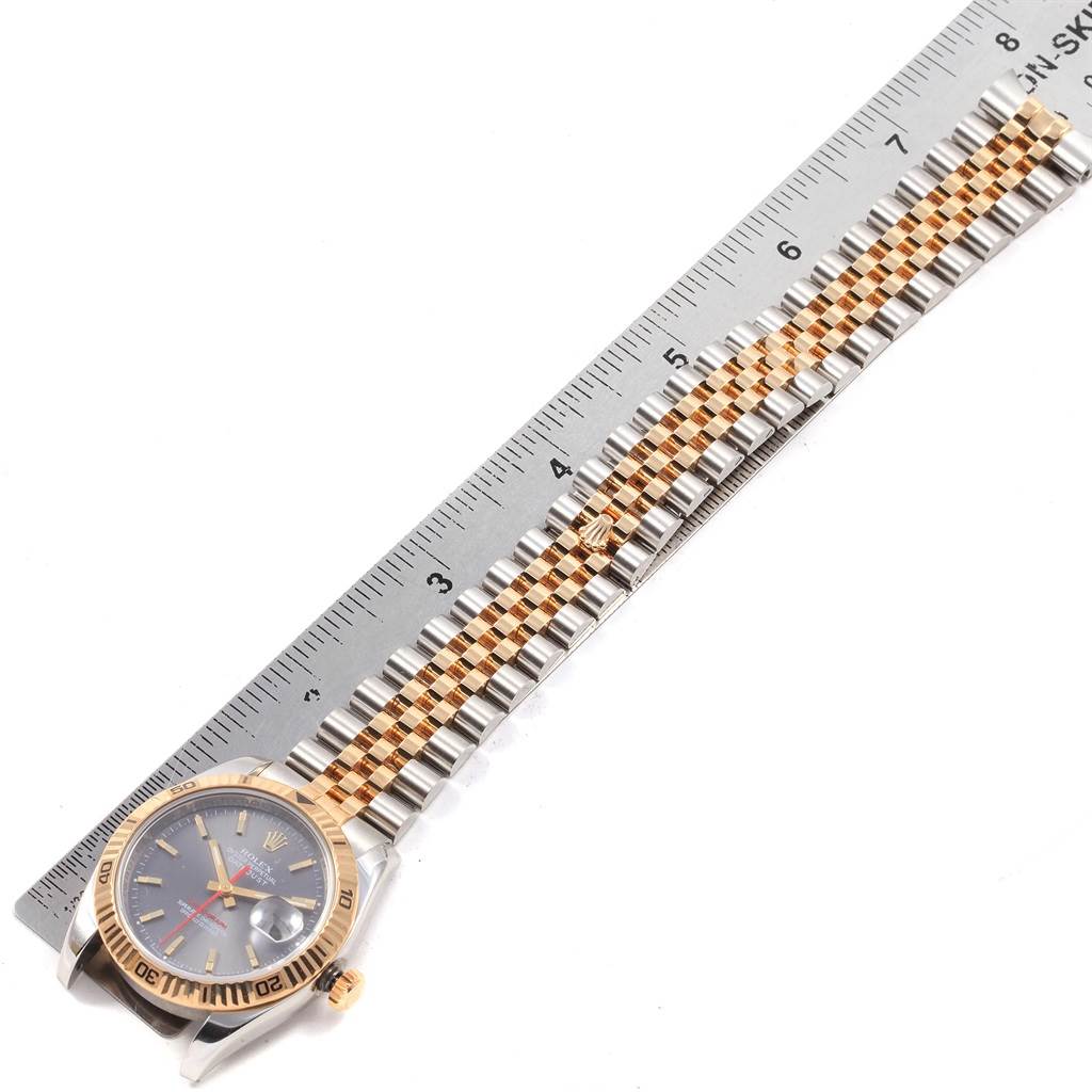 The image shows a top-down view of a Rolex Turn-o-Graph 116263 Men's Steel and Gold (two tone) Grey Dial 116263 Men's Steel and Gold (two tone) Grey Dial model watch, showcasing the face, bezel, and part of the band aligned with a ruler.