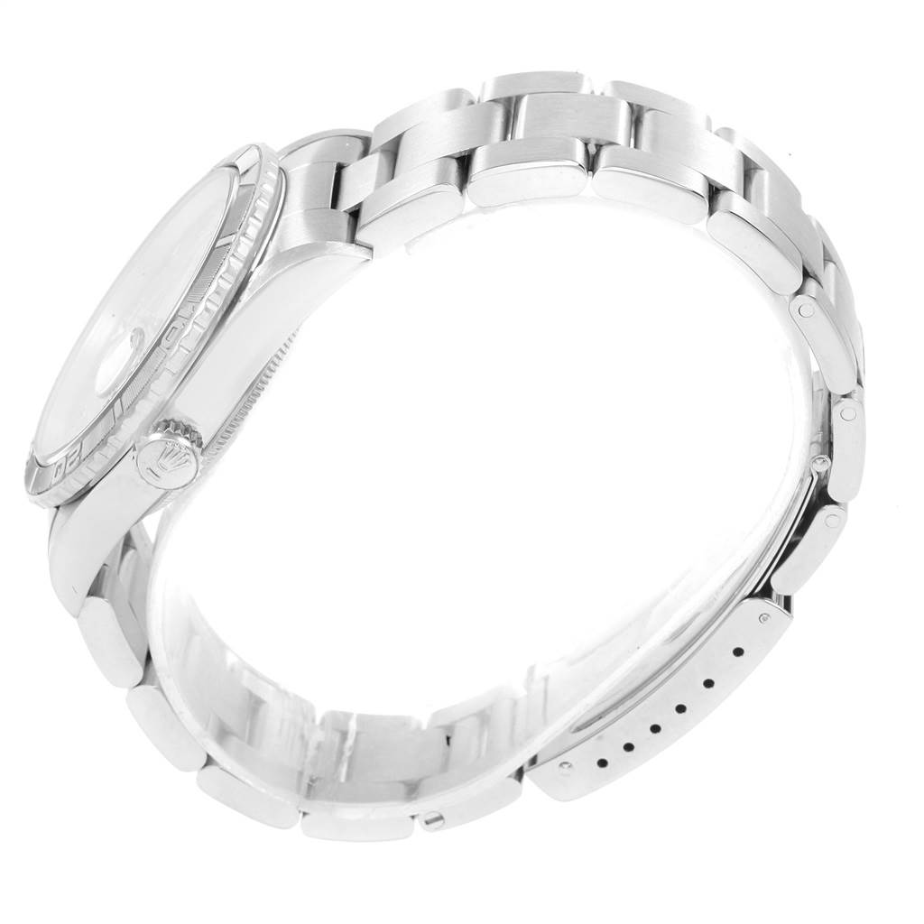 This image shows a side view of a Rolex Turn-o-Graph 16264 Men's Stainless Steel Silver Dial 16264 Men's Stainless Steel Silver Dial watch, focusing on its bracelet, bezel, and crown.