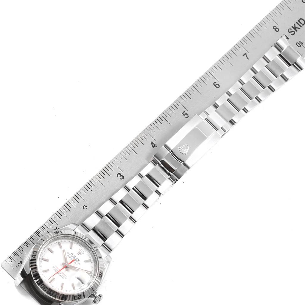 The image shows a top-down view of a Rolex Turn-o-Graph 116264 Men's Stainless Steel White Dial 116264 Men's Stainless Steel White Dial watch, highlighting its bracelet and clasp with a ruler for scale.