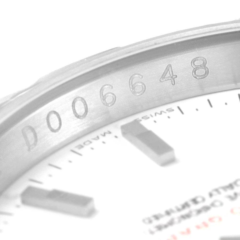 This close-up angle of the Rolex Turn-o-Graph 116264 Men's Stainless Steel White Dial 116264 Men's Stainless Steel White Dial watch shows the serial number engraved on the inner bezel.