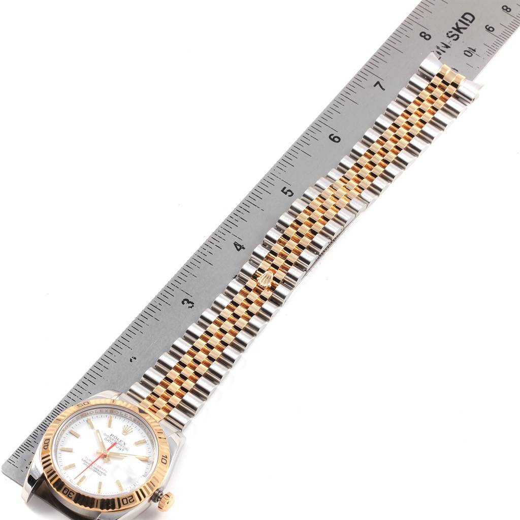 The image shows a Rolex Turn-o-Graph 116263 Men's Stainless Steel White Dial 116263 Men's Stainless Steel White Dial watch laying flat with a ruler next to its two-tone bracelet and face, seen from above.