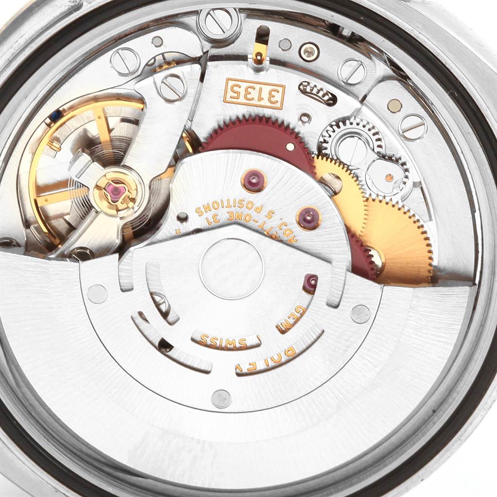 The image shows an up-close view of the movement mechanism of the Rolex Turn-o-Graph 116264 Men
s Stainless Steel Black Dial 116264 Men
s Stainless Steel Black Dial watch.