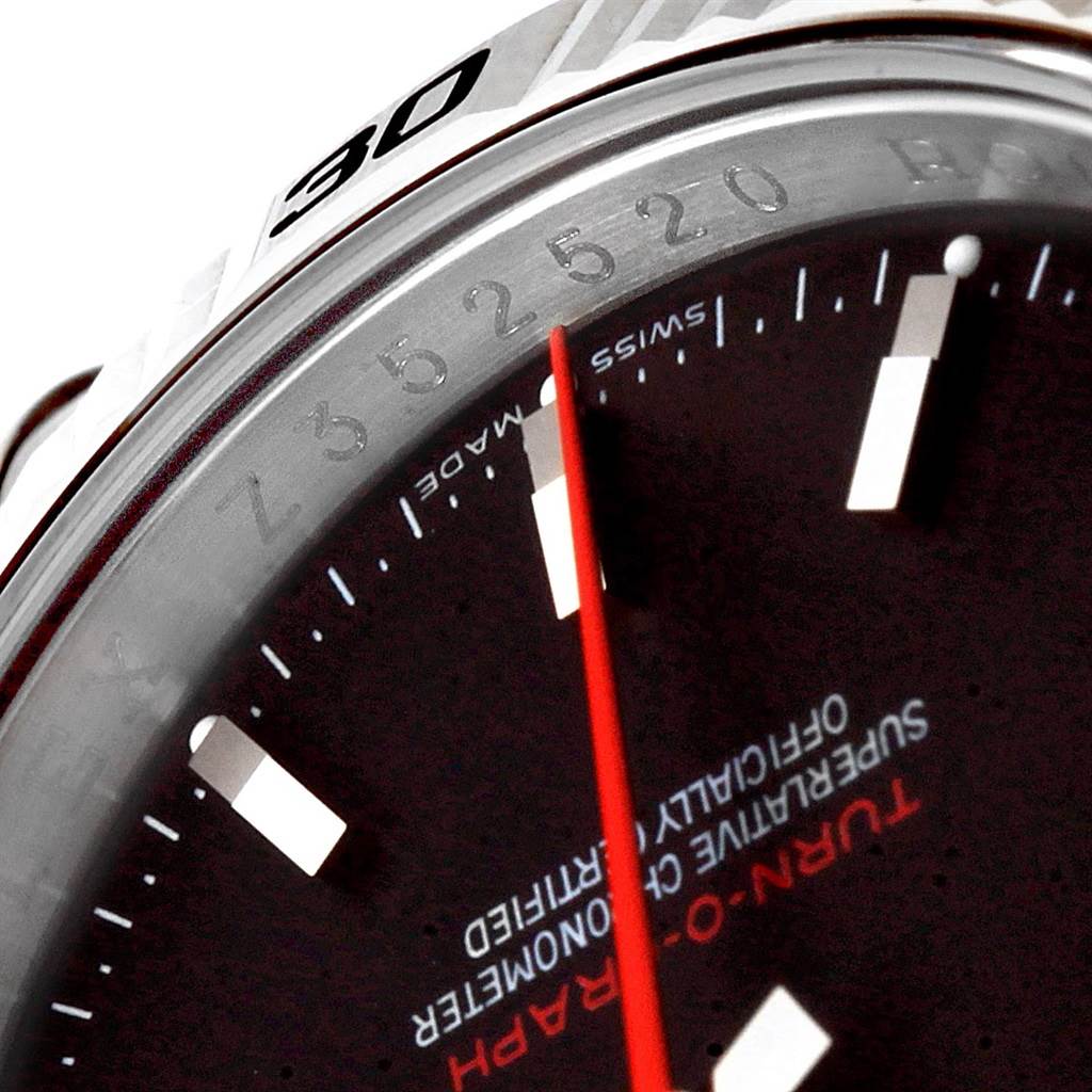 This close-up image of the Rolex Turn-o-Graph 116264 Men
s Stainless Steel Black Dial 116264 Men
s Stainless Steel Black Dial watch shows part of the dial, red second hand, and the edge of the bezel.