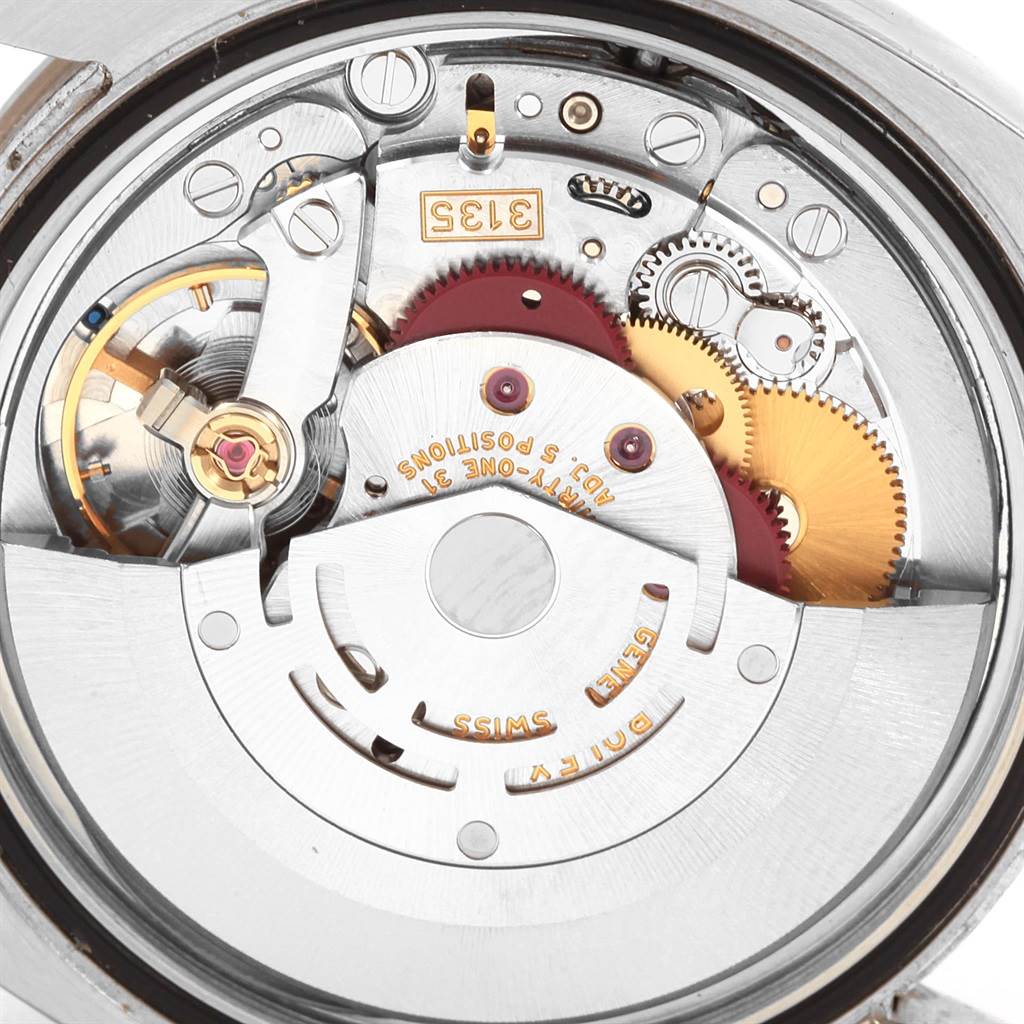 The image shows the intricate inner mechanisms and gears of a Rolex Turn-o-Graph 116264 Men
s Stainless Steel Blue Dial 116264 Men
s Stainless Steel Blue Dial watch from the back angle.