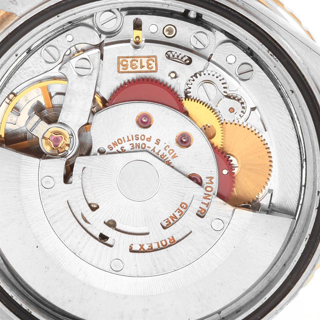 This image shows the internal mechanics of the Rolex Turn-o-Graph 16263 Men's Steel and Gold (two tone) Champagne Dial 16263 Men's Steel and Gold (two tone) Champagne Dial watch from a close-up angle, focusing on the movement and gears.