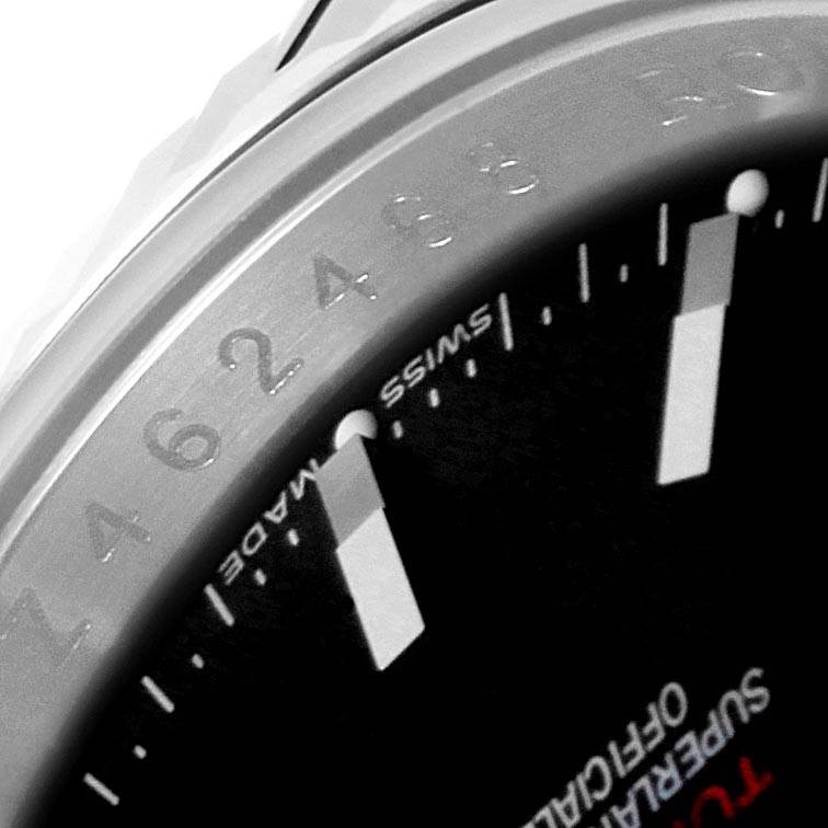 The image shows a close-up of the bezel and part of the dial of the Rolex Turn-o-Graph 116264 Men
s Stainless Steel Black Dial 116264 Men
s Stainless Steel Black Dial watch, highlighting the markers and Swiss Made text.