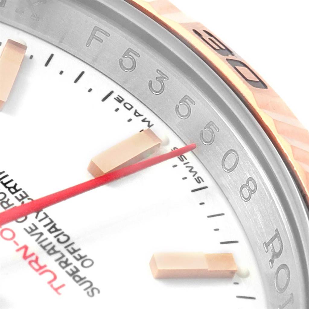 The close-up image shows part of the dial, the red second hand, and the bezel of the Rolex Turn-o-Graph 116261 Men
s Stainless Steel White Dial 116261 Men
s Stainless Steel White Dial model.