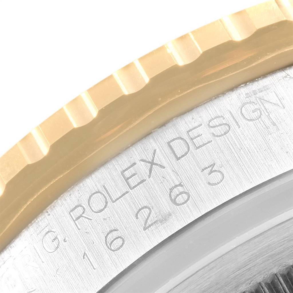 This image shows a close-up of the bezel and part of the casing, featuring the Rolex Turn-o-Graph 16263 Men's Steel and Gold (two tone) Beige Dial 16263 Men's Steel and Gold (two tone) Beige Dial model engraving.