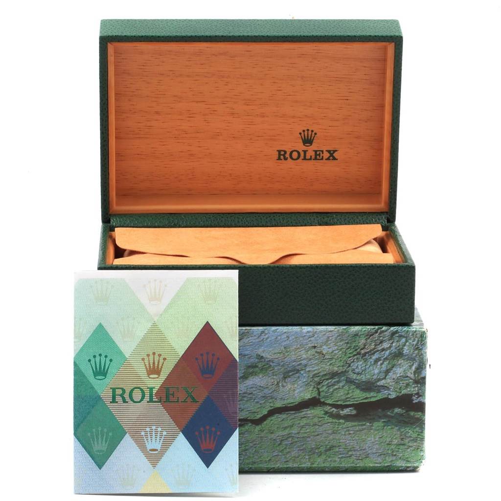 This image shows a green Rolex box and a booklet for the Turn-o-Graph model, with the box open to reveal a wooden interior.