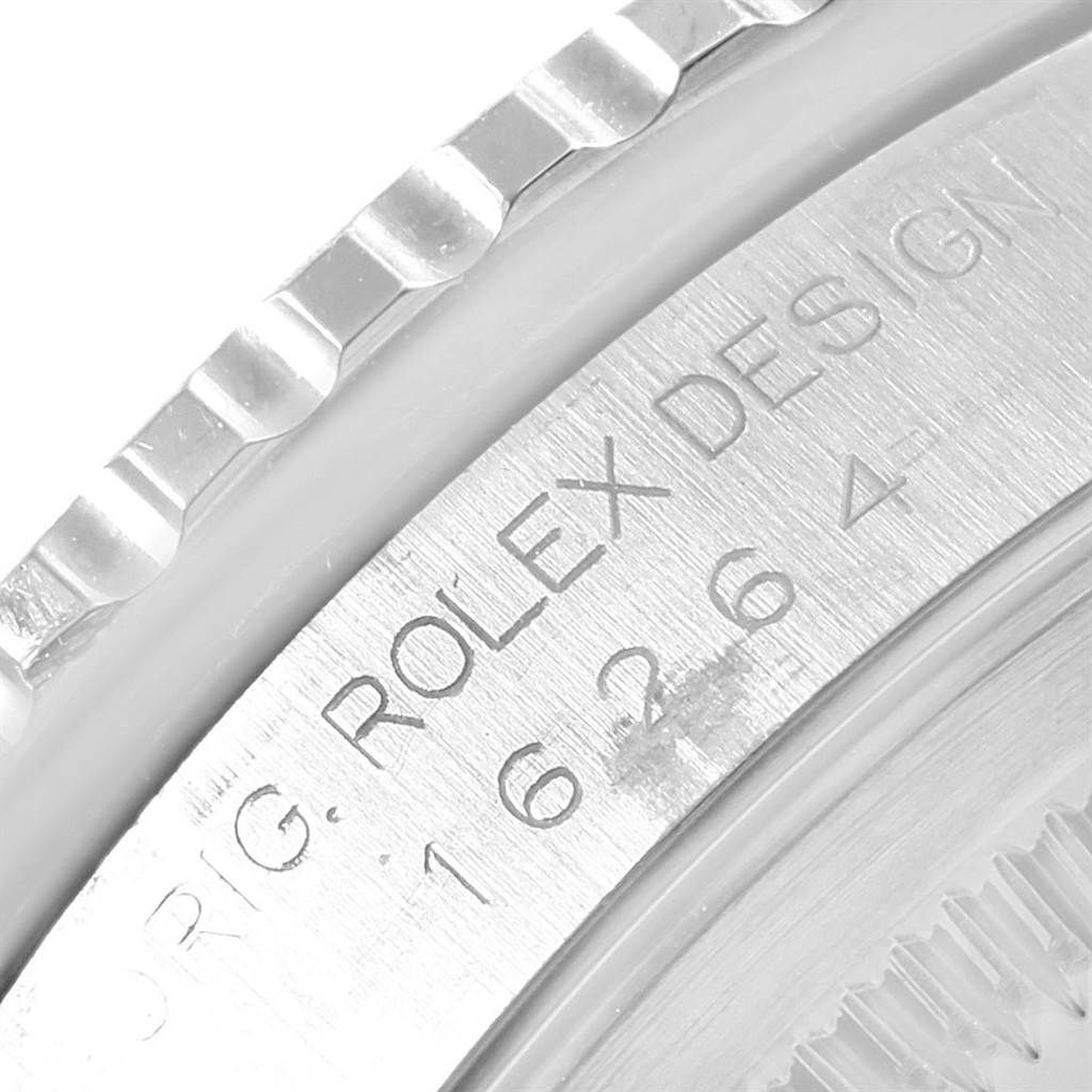 The image shows a close-up of the bezel and engraved case of a Rolex Turn-o-Graph 16264 Men
s Stainless Steel White Dial 16264 Men
s Stainless Steel White Dial model watch.