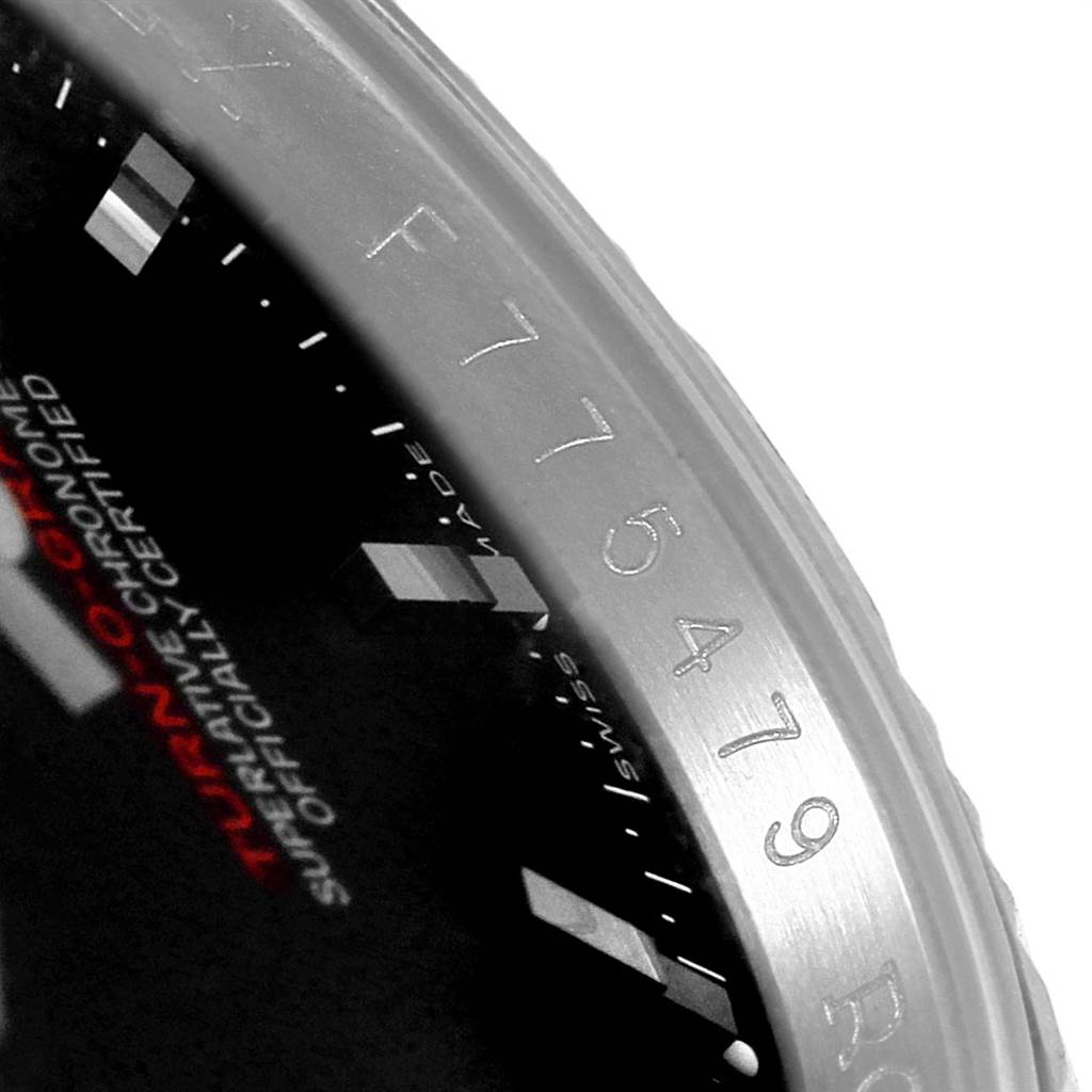 The image shows a partial view of the bezel and part of the dial of a Rolex Turn-o-Graph 116264 Men
s Stainless Steel Black Dial 116264 Men
s Stainless Steel Black Dial watch, highlighting the model name and serial number.