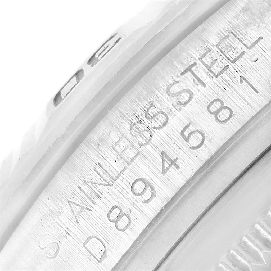 This close-up image shows the serial number and stainless steel engraving on a Rolex Turn-o-Graph 116264 Men
s Stainless Steel Blue Dial 116264 Men
s Stainless Steel Blue Dial watch.