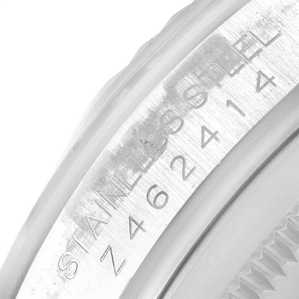 The image shows a close-up of the serial number and "STAINLESS STEEL" engraving on the side of a Rolex Turn-o-Graph 116264 Men
s Stainless Steel White Dial 116264 Men
s Stainless Steel White Dial watch case.