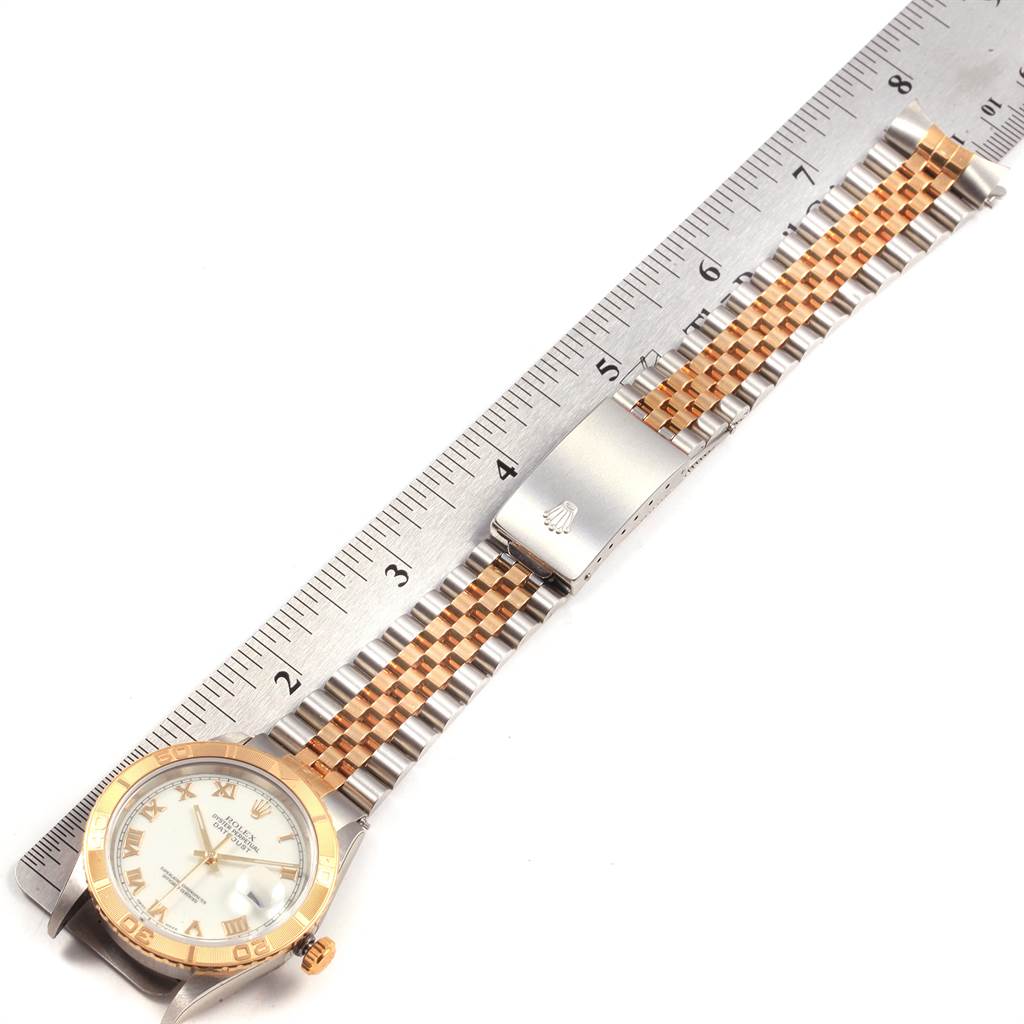 The image shows a Rolex Turn-o-Graph 16263 Men
s Steel and Gold (two tone) White Dial 16263 Men
s Steel and Gold (two tone) White Dial watch from a top-down angle, highlighting the watch face, bezel, and band with a ruler for scale.